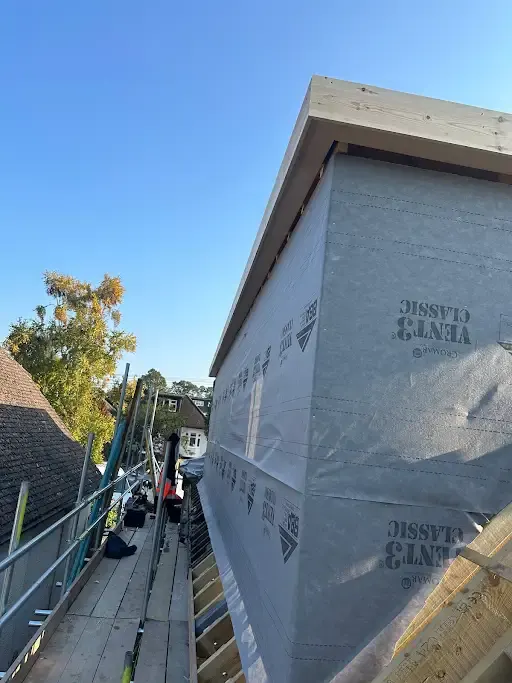 Timber frame wrapped in breather membrane