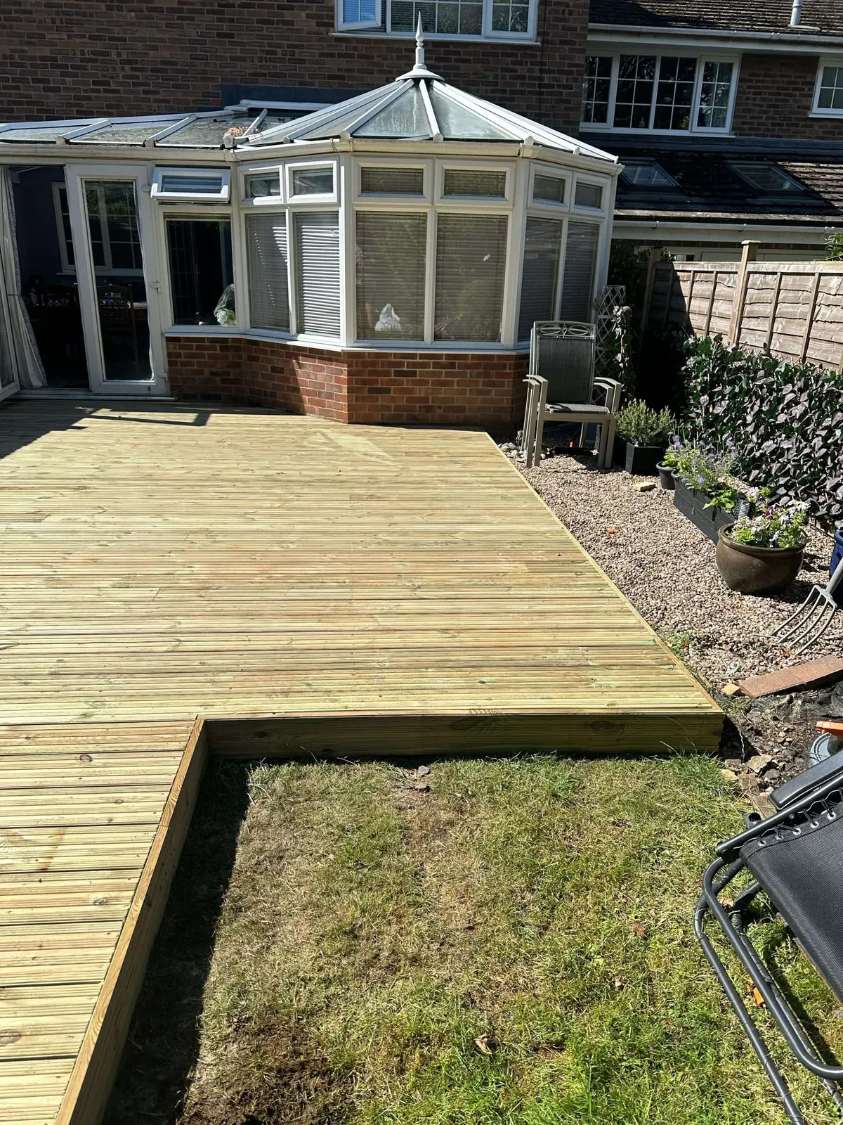 New decking built out from a conservatory