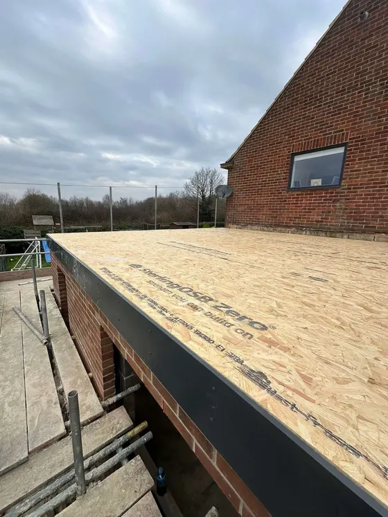Flat roof deck boarded and ready for covering