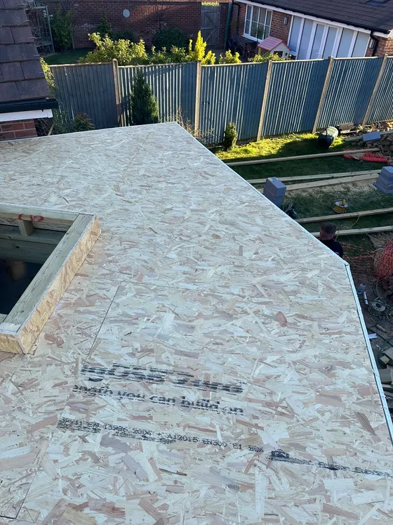 Flat roof deck with a rooflight upstand