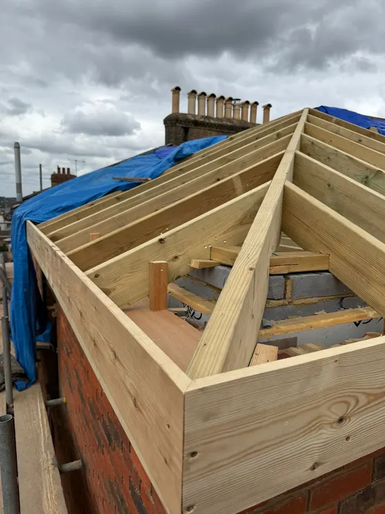 Hipped roof frame with a lantern opening