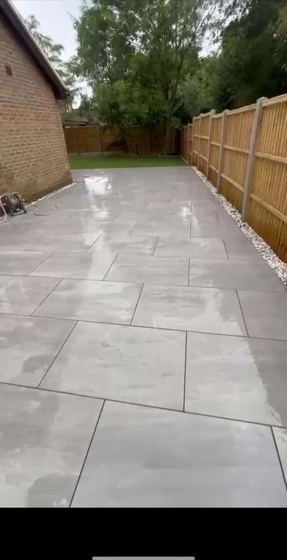 Porcelain path running alongside a new fence