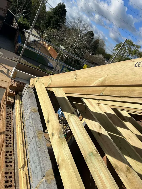Rafters cut and fixed over new blockwork