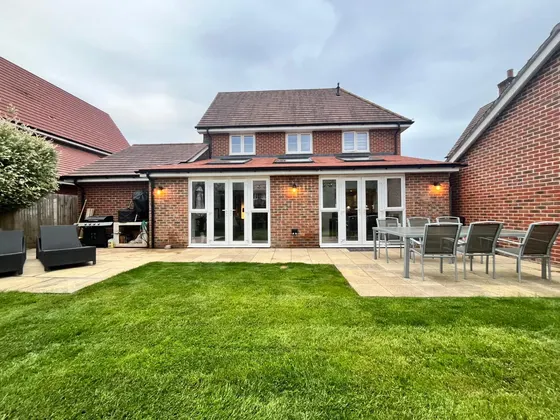 Rear garden with new lawn and patio seating area