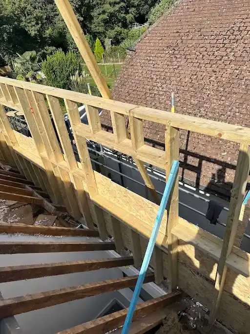 New rafters landing on a brick wall