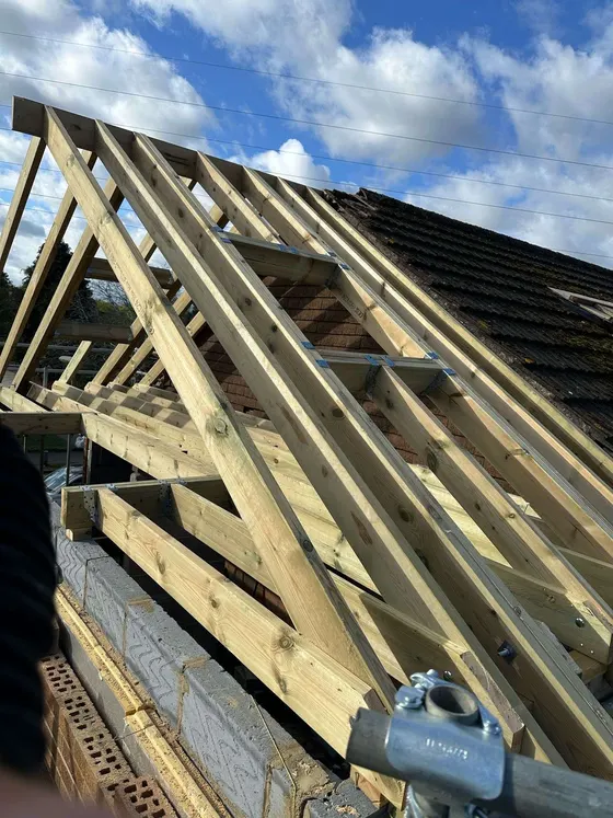 Roof timbers going up with scaffold around