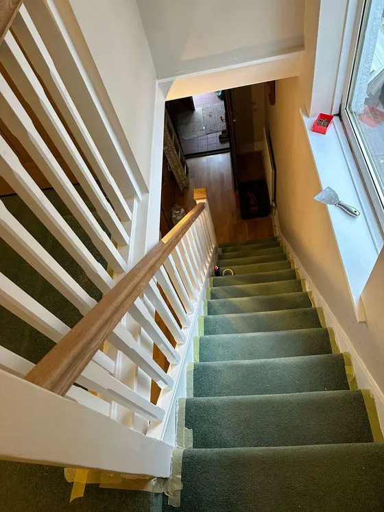 New white spindles and oak rail on a staircase