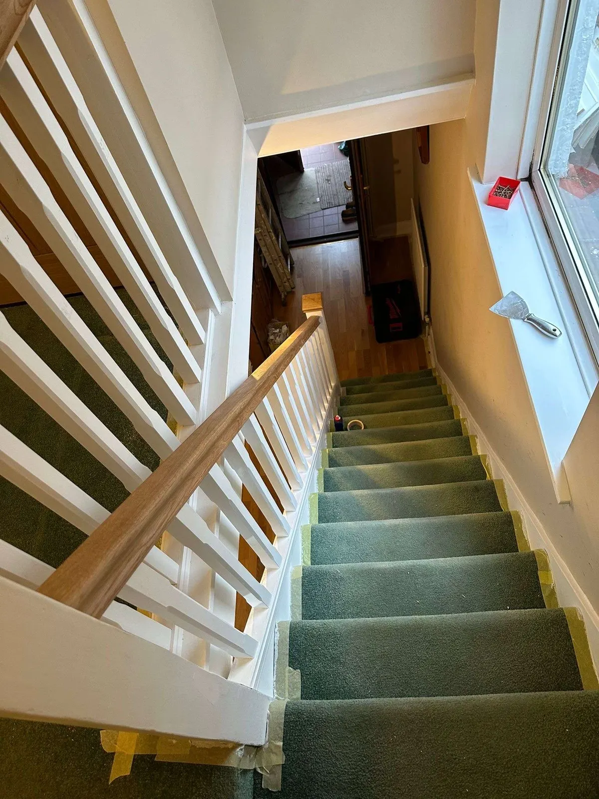 New white spindles and oak rail on a staircase