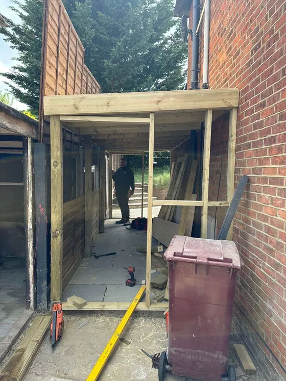 Timber-framed side porch going up