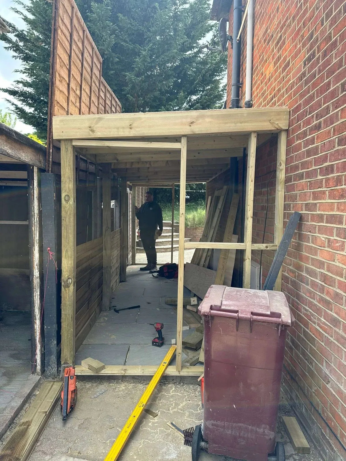 Timber-framed side porch going up